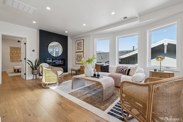 57 Niagara Ave, San Francisco, CA 94112 - living area with light wood-style floors, recessed lighting, and a large fireplace