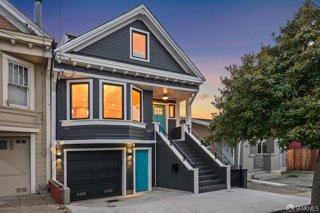 57 Niagara Ave, San Francisco, CA 94112 - view of front of property featuring a garage, driveway, and stairway