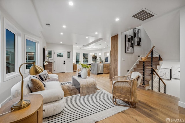 57 Niagara Ave, San Francisco, CA 94112 - living room with light wood finished floors, stairway, and recessed lighting