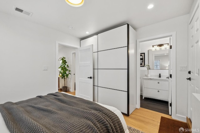 57 Niagara Ave, San Francisco, CA 94112 - bedroom featuring light wood-style floors, recessed lighting, and ensuite bath