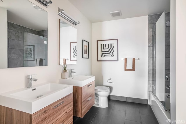 full bathroom featuring vanity, toilet, and combined bath / shower with glass door