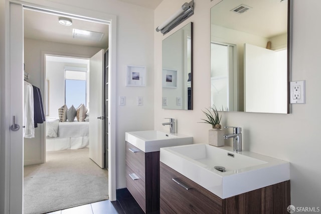 bathroom featuring vanity and tile patterned flooring