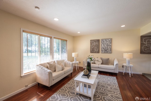 living area featuring wood finished floors and baseboards