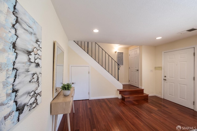 entrance foyer featuring stairway, recessed lighting, baseboards, and wood finished floors