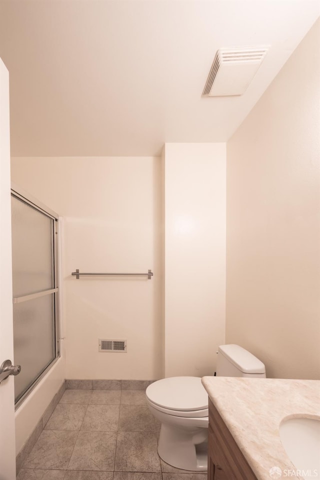 bathroom with visible vents, toilet, vanity, and shower / bath combination with glass door