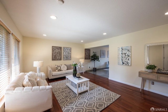 living room with recessed lighting, wood finished floors, and baseboards