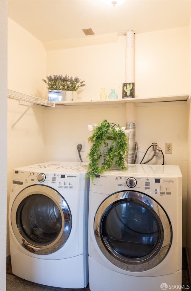 laundry room featuring laundry area and washing machine and dryer