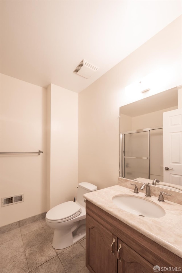 bathroom featuring visible vents, toilet, a stall shower, and vanity