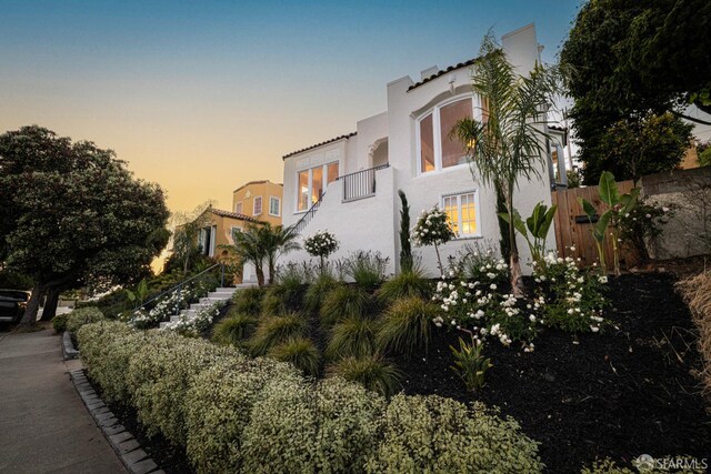 130 Cerritos Ave, San Francisco, CA 94127 - view of front of property featuring stucco siding, stairs, and a balcony