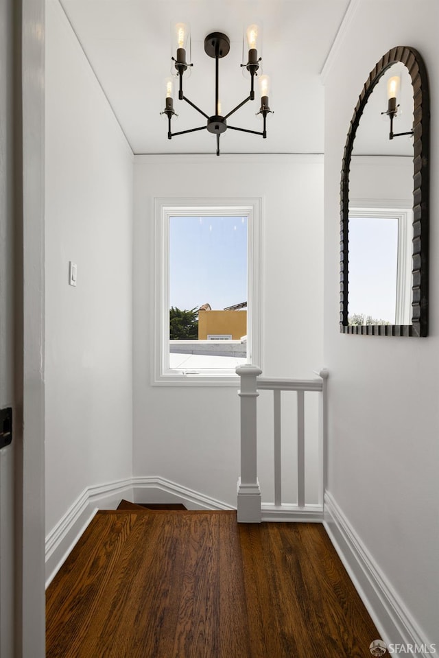 130 Cerritos Ave, San Francisco, CA 94127 - unfurnished dining area featuring a chandelier, baseboards, wood finished floors, and ornamental molding