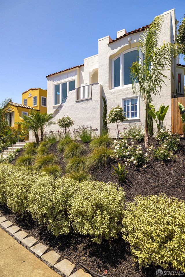 130 Cerritos Ave, San Francisco, CA 94127 - mediterranean / spanish house featuring stucco siding, a tiled roof, and a balcony