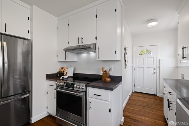 130 Cerritos Ave, San Francisco, CA 94127 - kitchen featuring stainless steel appliances, under cabinet range hood, dark countertops, dark wood-type flooring, and white cabinets