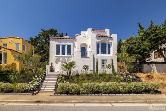 130 Cerritos Ave, San Francisco, CA 94127 - mediterranean / spanish-style home featuring stairway, stucco siding, a tile roof, and a chimney