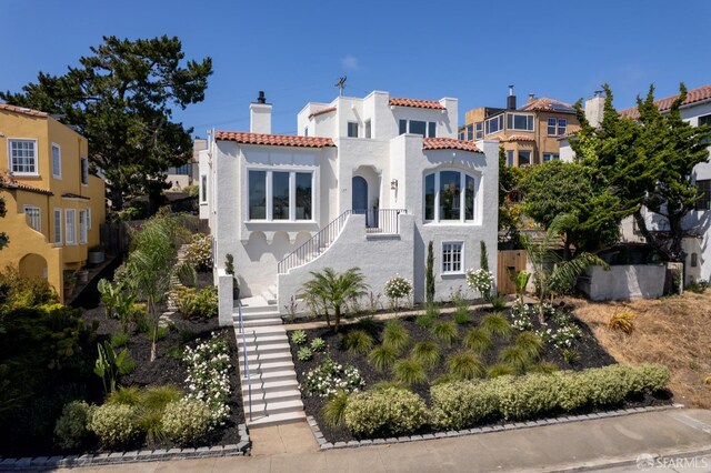 130 Cerritos Ave, San Francisco, CA 94127 - mediterranean / spanish-style home featuring stairs, a chimney, stucco siding, and a tiled roof