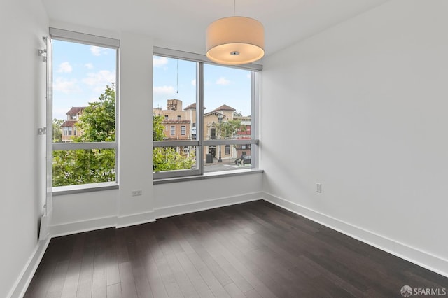 8 Buchanan St Unit 202, San Francisco, CA 94102 - unfurnished room with dark wood finished floors, plenty of natural light, and baseboards