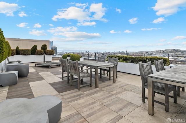 8 Buchanan St Unit 202, San Francisco, CA 94102 - wooden deck featuring outdoor dining space, a view of city, and a patio area