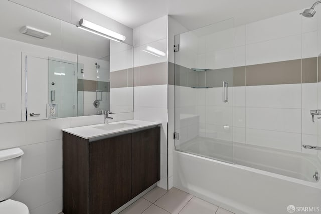 8 Buchanan St Unit 202, San Francisco, CA 94102 - full bath with toilet, combined bath / shower with glass door, tile walls, vanity, and tile patterned floors