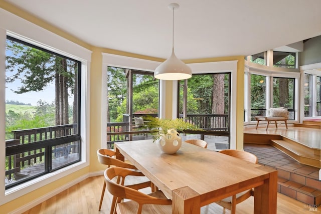 dining space with light wood-style floors