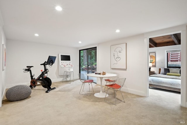 exercise area with baseboards, recessed lighting, and carpet flooring