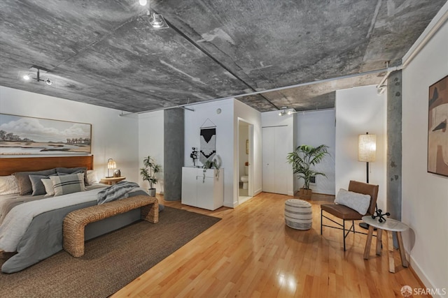 bedroom with hardwood / wood-style floors