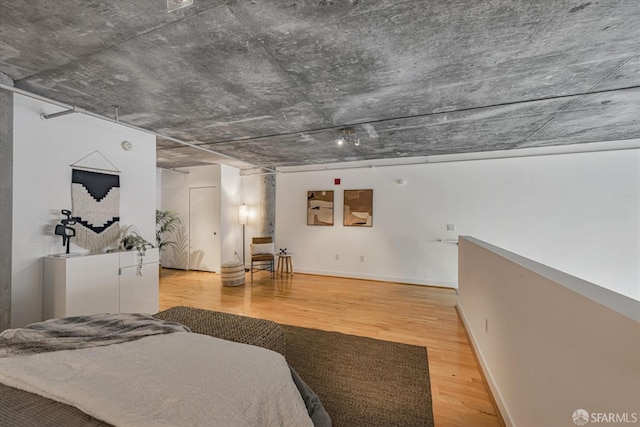 bedroom with hardwood / wood-style flooring