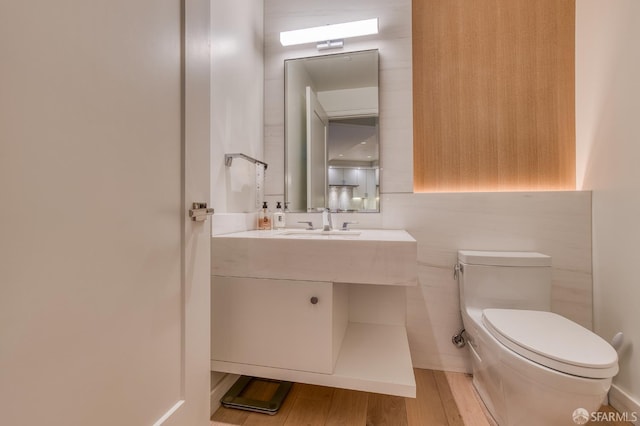 875 California St Unit 403, San Francisco, CA 94108 - half bathroom featuring toilet, vanity, and wood finished floors