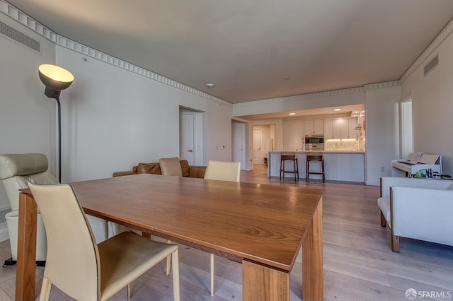 875 California St Unit 403, San Francisco, CA 94108 - dining space featuring light wood-style floors