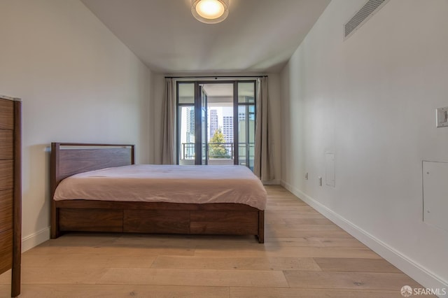 875 California St Unit 403, San Francisco, CA 94108 - bedroom featuring baseboards and light wood-style floors