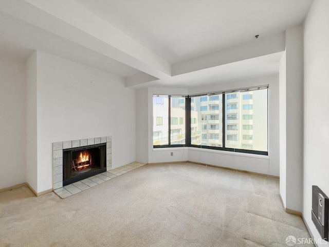 601 Van Ness Ave Unit 71, San Francisco, CA 94102 - unfurnished living room with carpet flooring, a tiled fireplace, and heating unit