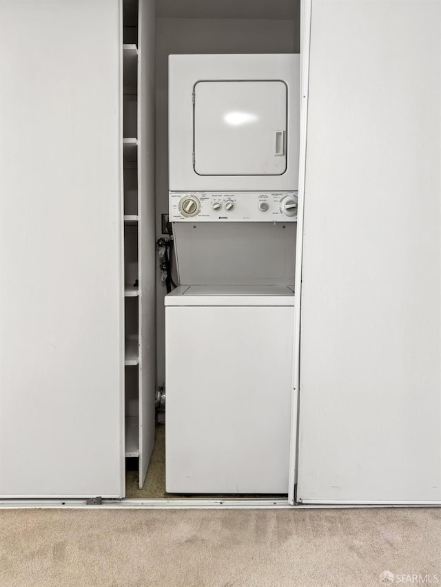 601 Van Ness Ave Unit 71, San Francisco, CA 94102 - laundry area featuring stacked washing machine and dryer and carpet flooring