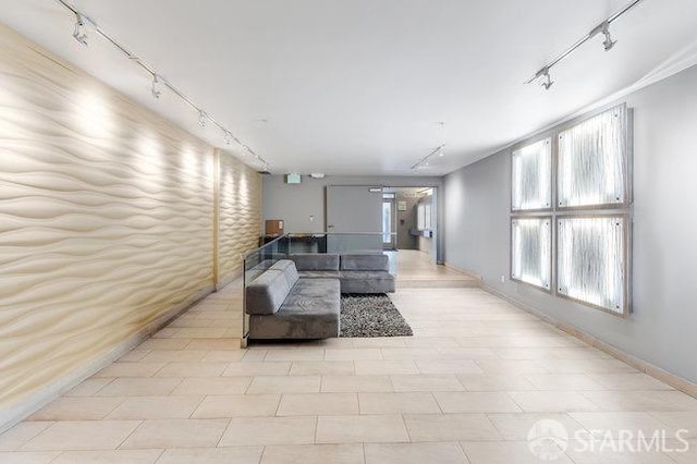 living room with light tile patterned flooring and rail lighting