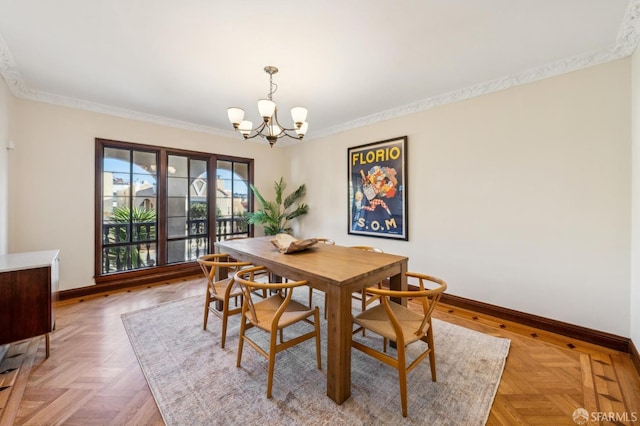 dining space featuring parquet floors, ornamental molding, and a chandelier