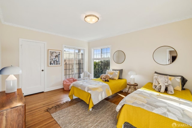 bedroom with hardwood / wood-style floors