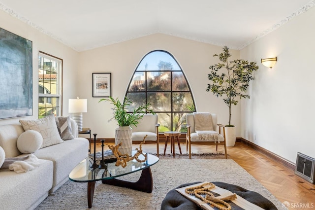 living room featuring light parquet floors and lofted ceiling