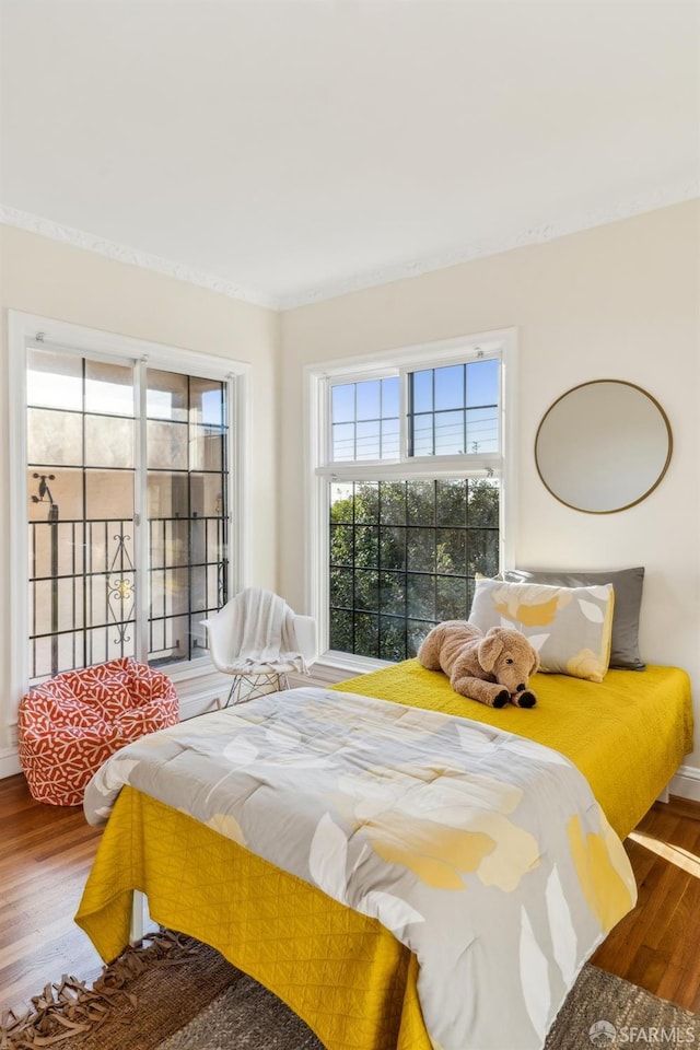 bedroom with wood-type flooring