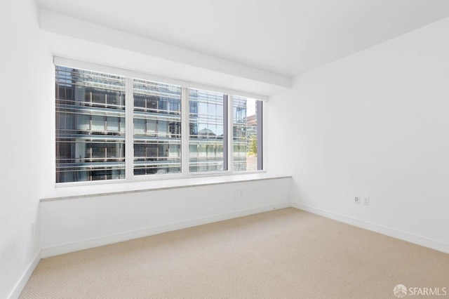 301 Mission St Unit 8E, San Francisco, CA 94105 - spare room featuring carpet and baseboards