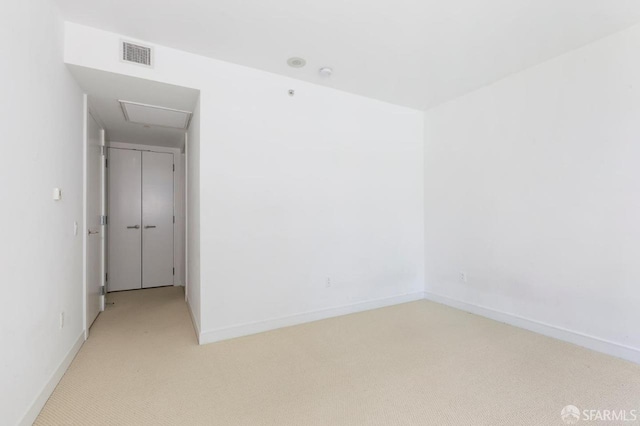 301 Mission St Unit 8E, San Francisco, CA 94105 - empty room featuring light carpet and baseboards