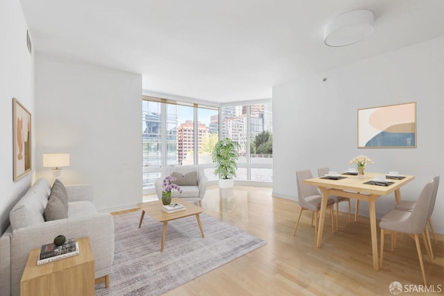 301 Mission St Unit 8E, San Francisco, CA 94105 - living area with wood finished floors and floor to ceiling windows