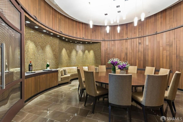301 Mission St Unit 8E, San Francisco, CA 94105 - dining area featuring wooden walls and dark marble finish flooring