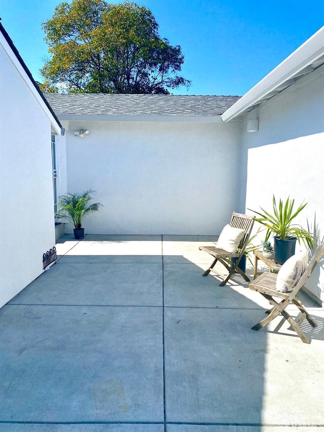 view of patio / terrace with an attached garage