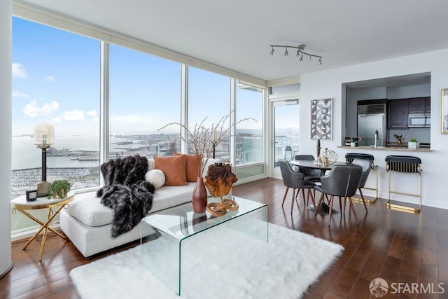 sunroom / solarium with a water view