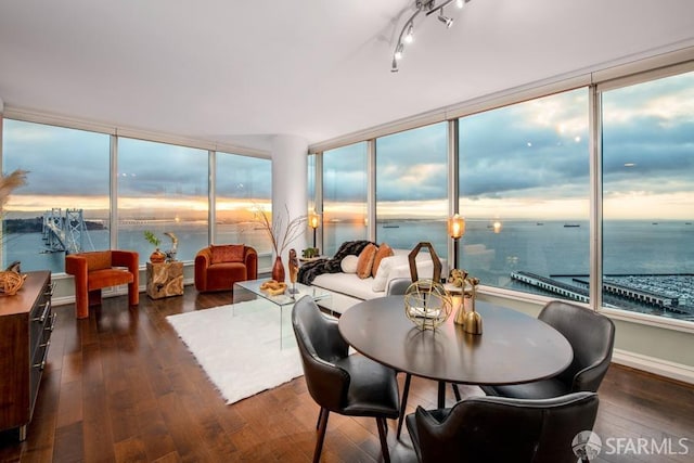 sunroom / solarium with a water view