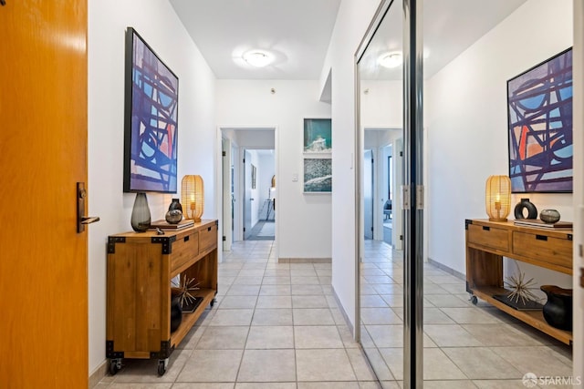 hallway with light tile patterned floors