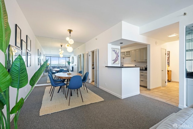 dining space featuring light colored carpet