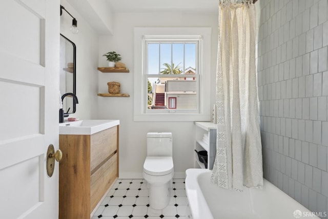 bathroom with toilet and vanity