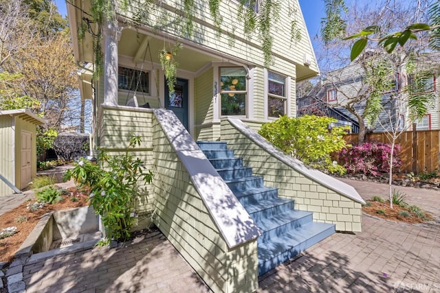 doorway to property with fence