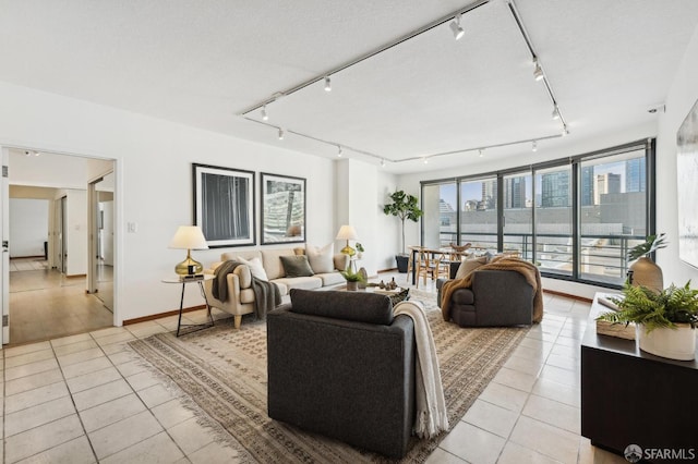 interior space featuring light tile patterned floors and a textured ceiling