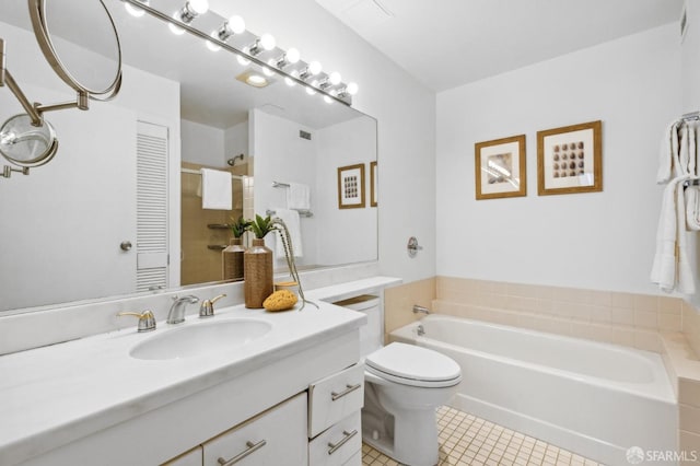 bathroom with tile patterned floors, vanity, toilet, and a washtub