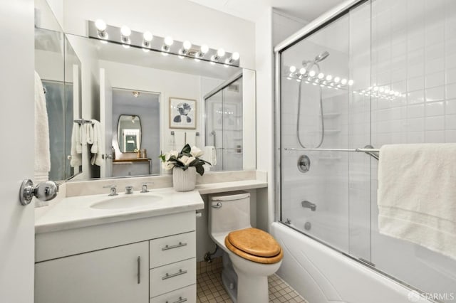 full bathroom with tile patterned flooring, vanity, toilet, and enclosed tub / shower combo