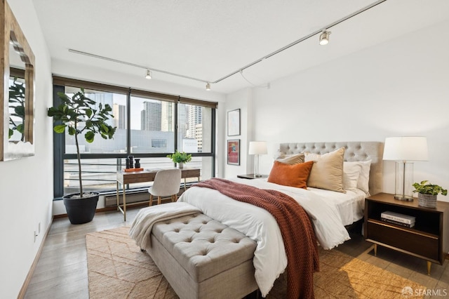 bedroom with wood-type flooring